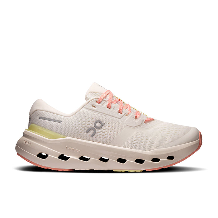 Light colored running shoe with distinctive cloud sole pods and coral pink laces, side view