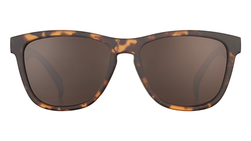 Tortoiseshell sunglasses with dark brown lenses, front view on white background