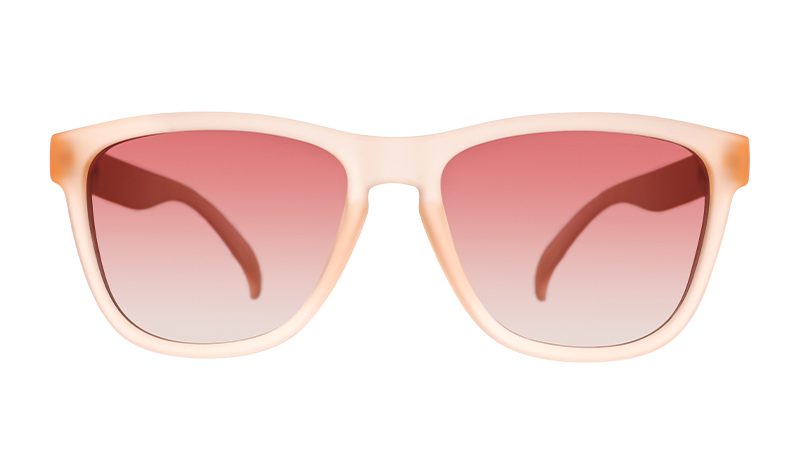 Translucent pink sunglasses with gradient rose lenses shown in front view against white background