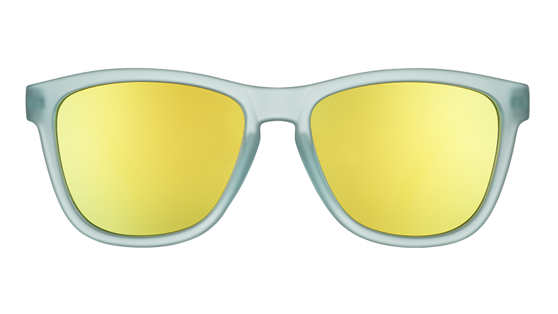 Mint green framed sunglasses with gold mirrored lenses, front view on transparent background