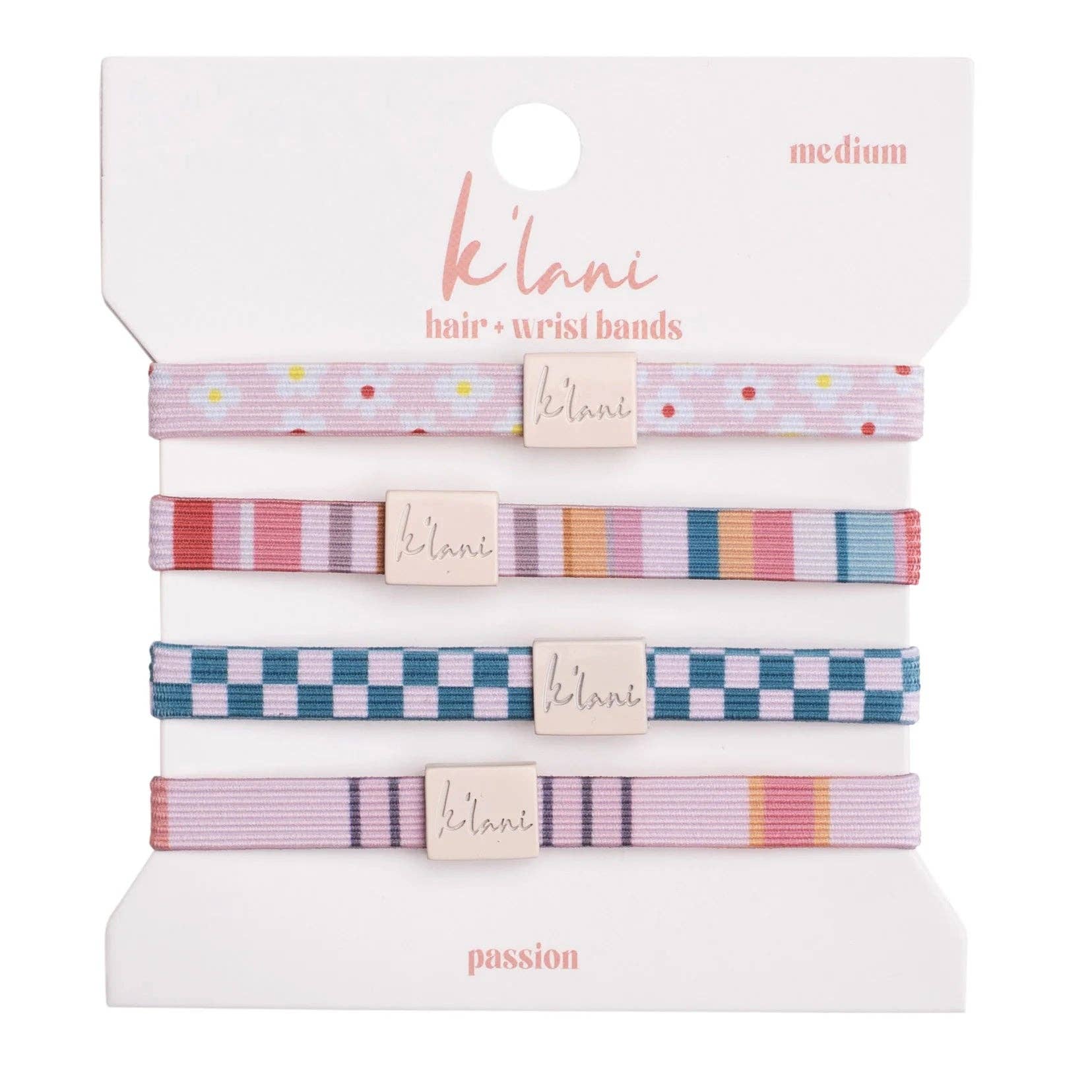 Set of four patterned elastic hair ties and wristbands on retail card, medium size