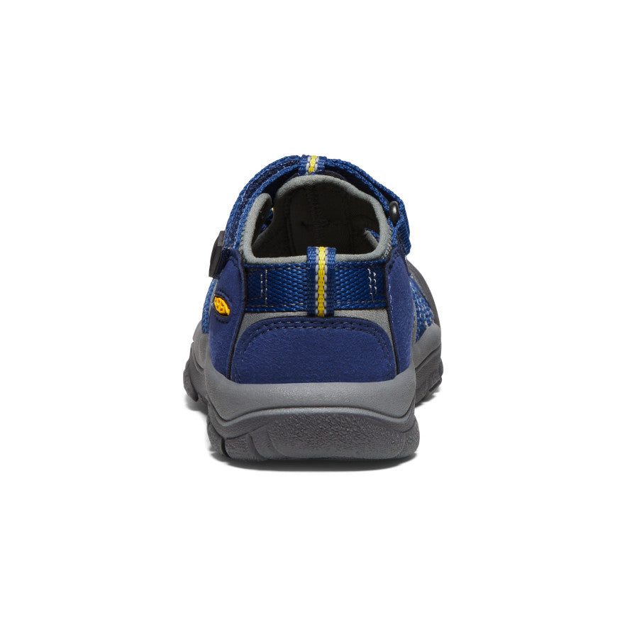 Blue children's water sandal with velcro strap and protective toe coverage, rear view