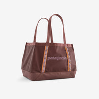 Large tote bag in dusty rose color with orange accent stripes and dual handles