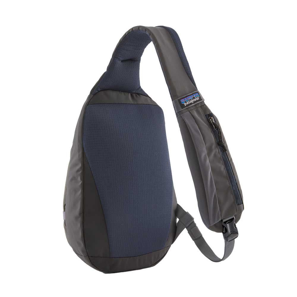Single-strap sling bag in navy and charcoal with zippered front pocket, angled view