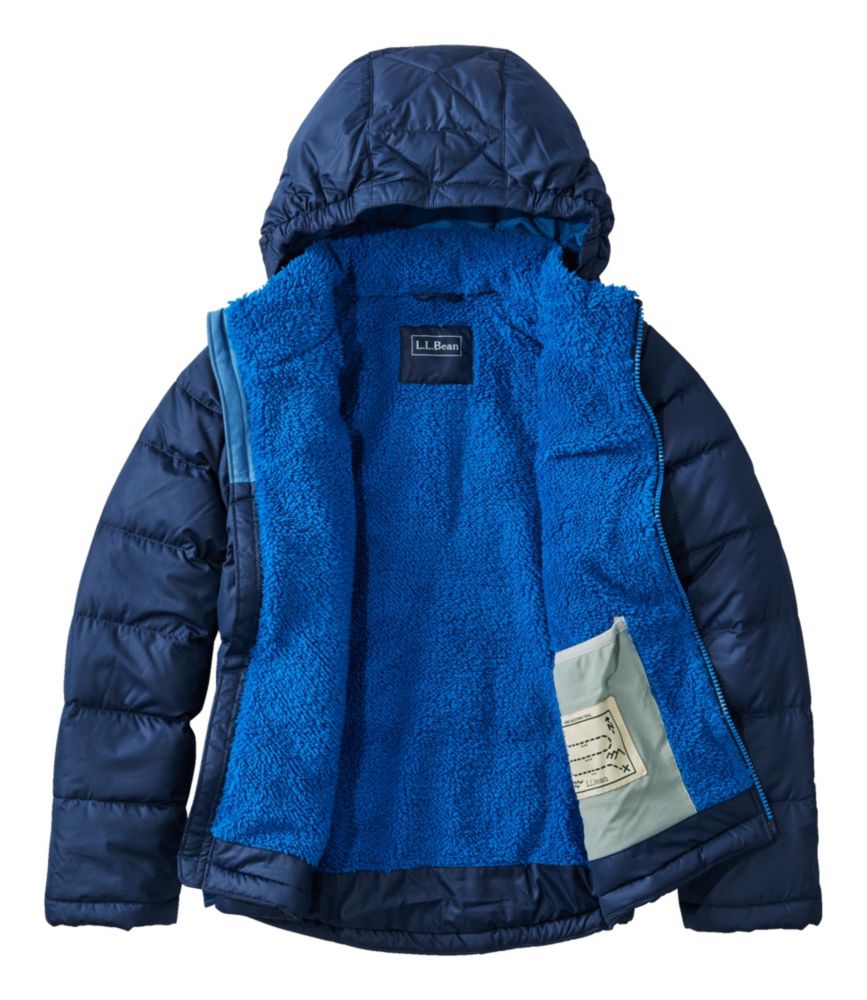 Kids' hooded puffer jacket opened flat showing bright blue sherpa lining interior, navy exterior