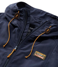 Close-up of dark navy full-zip jacket hood with orange drawcords and brand patch