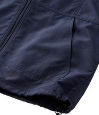 Close-up of dark navy zip-up jacket hem with side pocket and drawcord adjustment