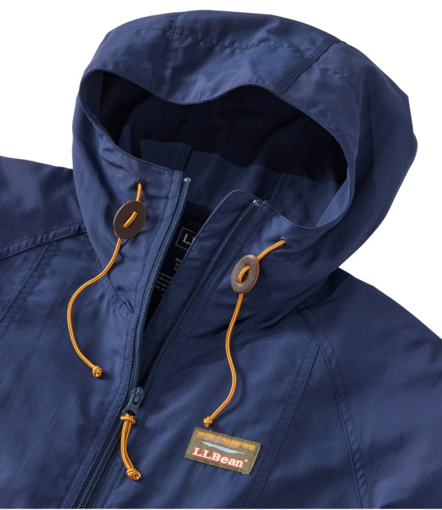 Dark navy hooded full-zip jacket with gold drawstrings and toggle adjusters, close-up view