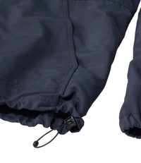 Close-up of navy jacket hem with drawcord adjustment toggle and side pocket detail