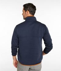 Man wearing navy blue textured knit pullover with quarter-zip collar, back view