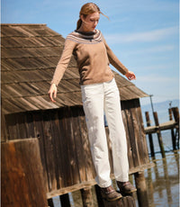 Women's crewneck Fair Isle sweater with patterned yoke, styled with white pants on a dock