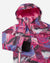 Children's winter jacket close-up showing hooded detail, zipper, and pink grey dotted plaid print