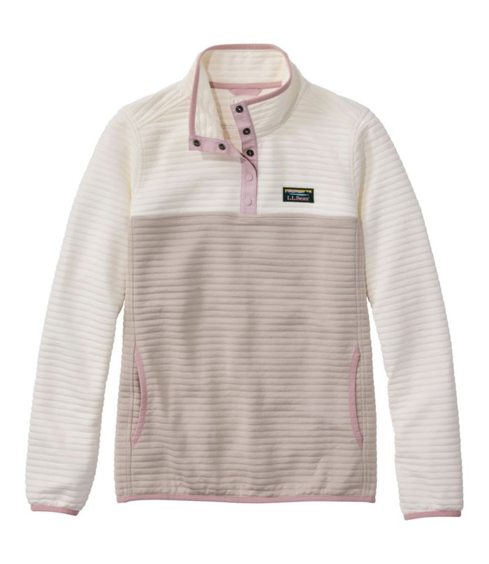 Women's colorblock pullover with snap neck, ribbed texture, side pockets, and pink trim accents