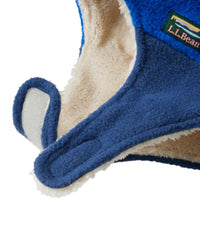 Close-up detail of blue fleece toddler hat with cream sherpa lining and chin strap closure