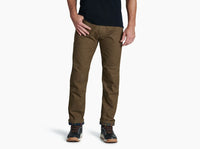 Men's olive brown utility pants with flannel lining visible at cuffs, front view on model