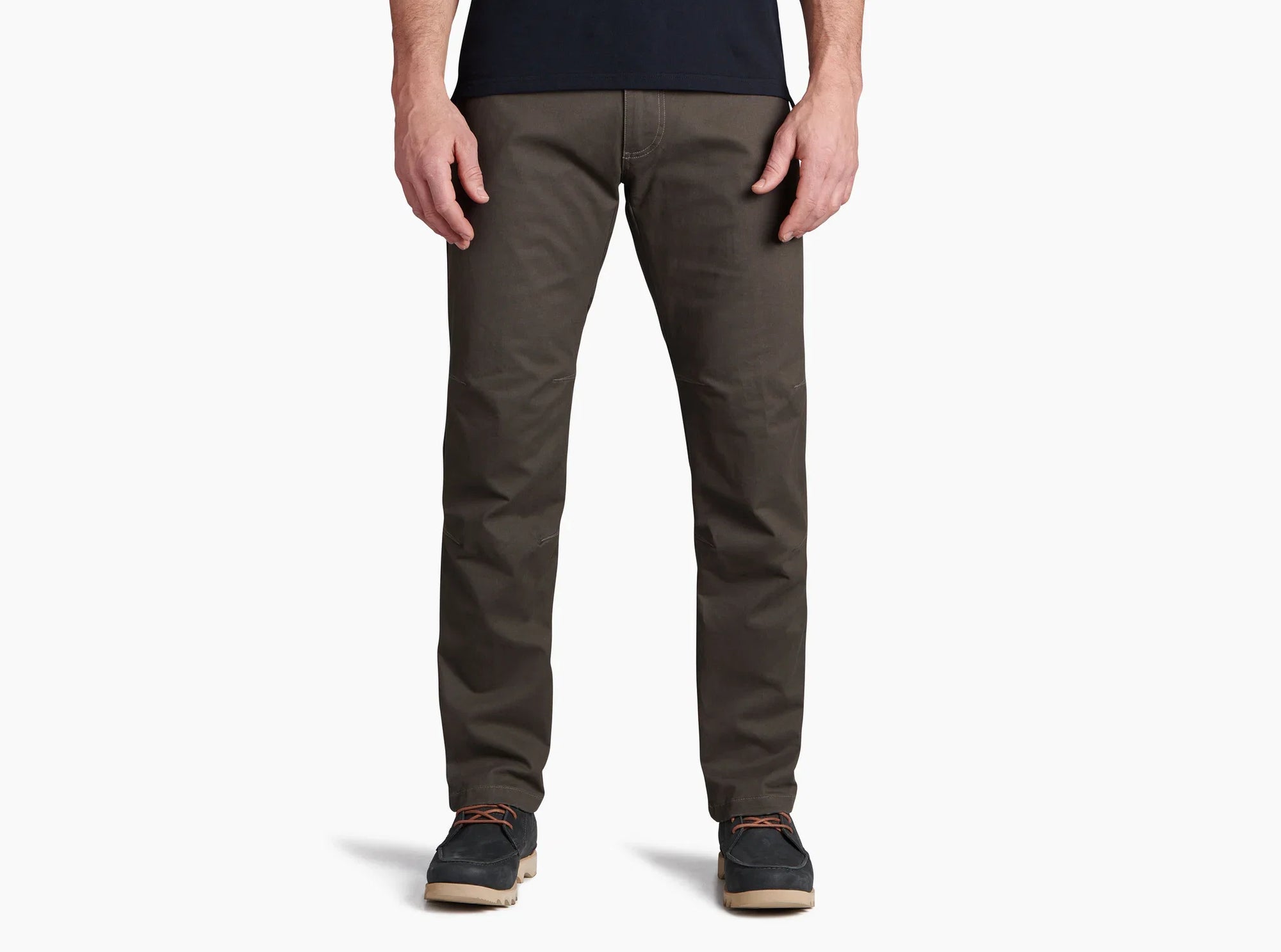 Men's slim-fit dark olive pants with articulated knees, front view on model