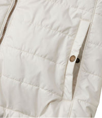 Cream quilted puffer jacket detail showing zipper, snap closure, and diamond stitching pattern