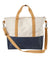 Two-tone canvas tote bag with cream upper, navy lower section, and tan straps