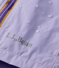 Light purple rain jacket with colorblock striping and water droplets on fabric surface