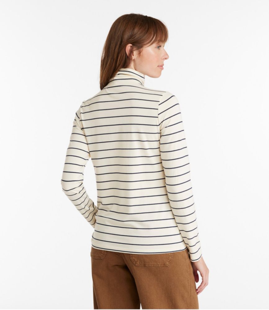Striped turtleneck sweater with horizontal navy stripes on cream background, back view