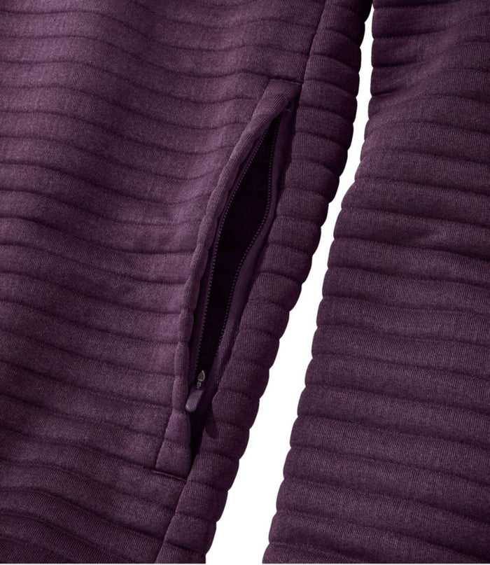 Close-up detail of a ribbed textured jacket side zip pocket in deep purple