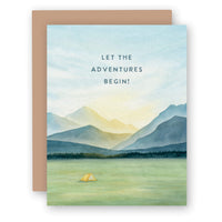 Greeting card with watercolor mountain landscape design and brown envelope, featuring camping tent