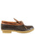 Low-cut rubber moc shoe with tan leather upper, lace detail, and textured gum outsole, side view