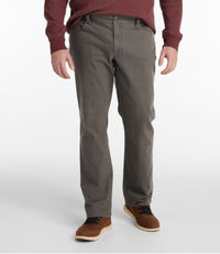 Men's straight-leg five-pocket pants in dark ash gray, front view, worn with brown suede shoes