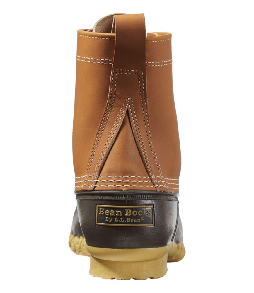 Rear view of 8-inch duck boot with tan leather upper, dark rubber lower, and gum sole