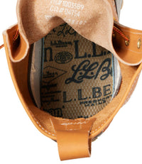 Close-up interior detail of a boot showing branded insole lining and tan leather construction