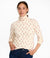 Women's long-sleeve turtleneck top in cream with red cardinal bird print, front view on model