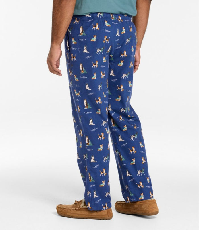 Men's navy blue flannel sleep pants with dog holiday print, back view with slippers