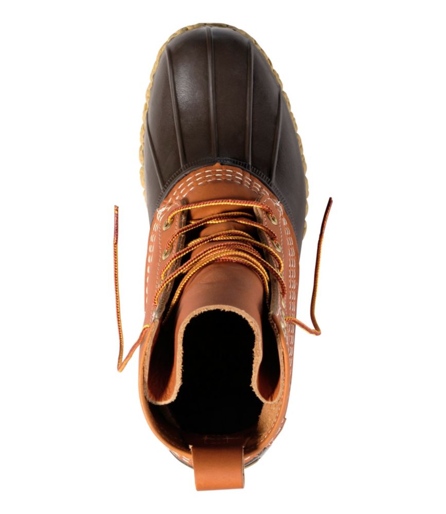 Top-down view of lace-up duck boot with tan leather upper and dark brown rubber toe cap