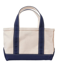 Small canvas tote bag with navy blue handles, bottom trim, and contrast stitching, front view