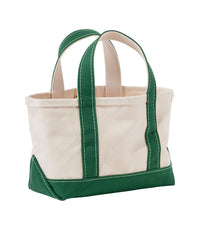 Small canvas tote bag with green handles, bottom trim, and natural cream body, angled view