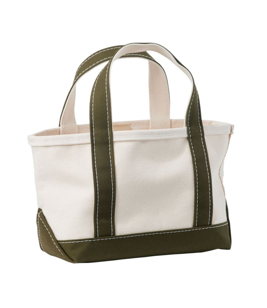 Open-top canvas tote bag with dark green handles and base trim, angled front view