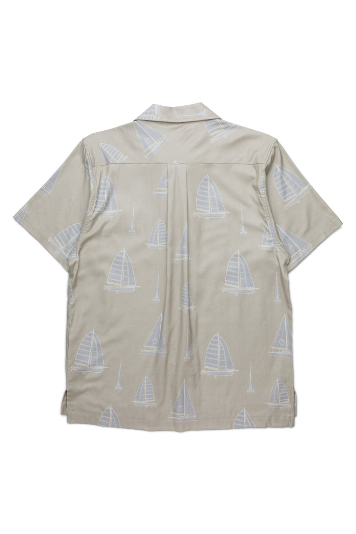 Short-sleeve button-up shirt with sailboat print pattern, back view on white background