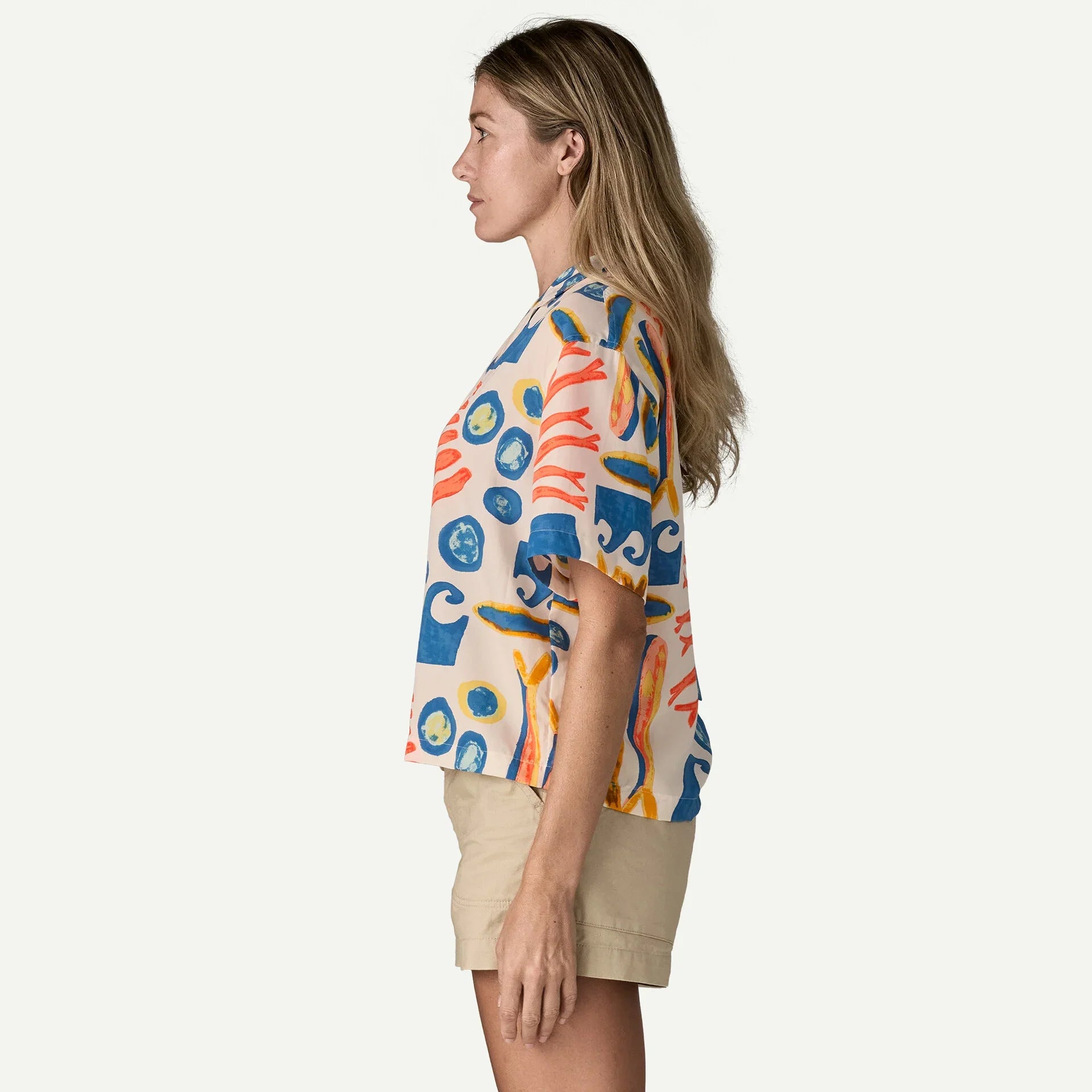 Short-sleeve button-up shirt with colorful abstract seafood pattern, side profile view