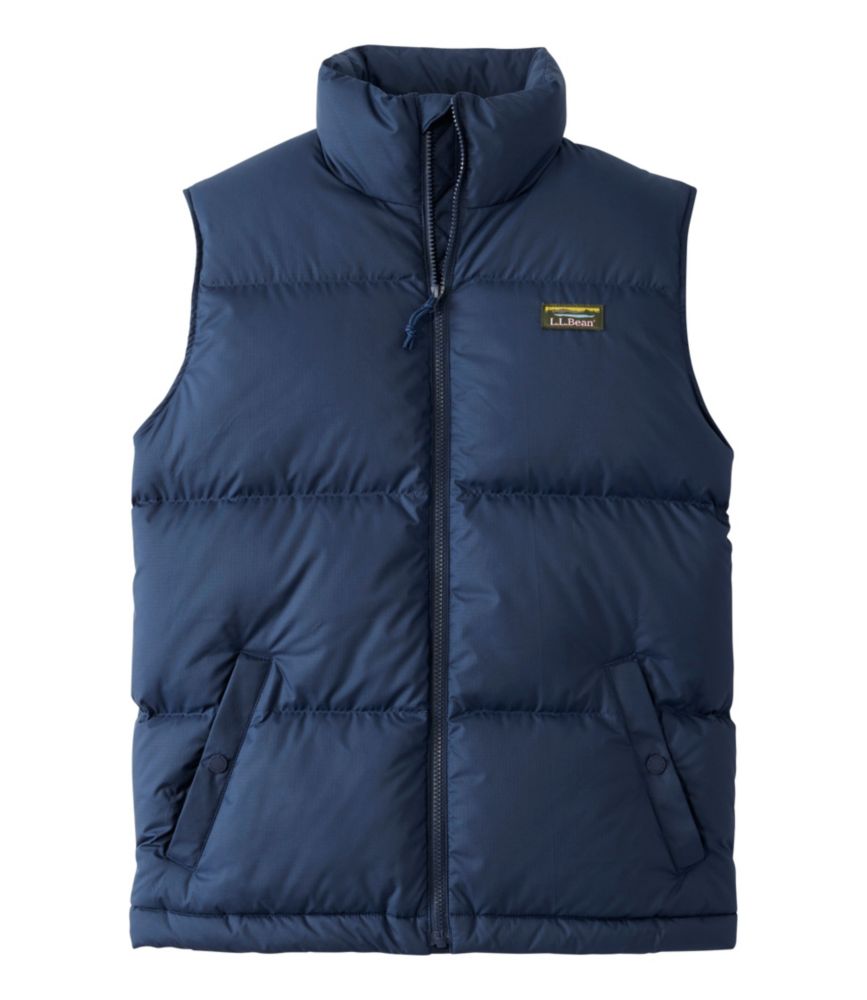 Men's navy blue quilted puffer vest with stand collar, full zip, and front pockets