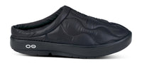 Black quilted slip-on mule with open back and cushioned platform sole, side view