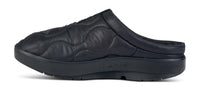 Black quilted slip-on mule with cushioned sole, side profile view