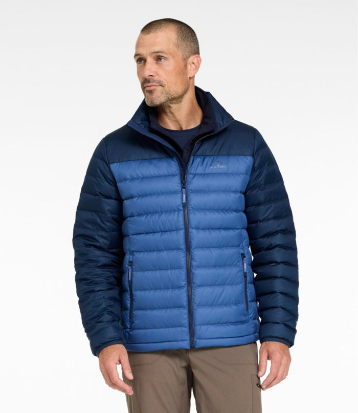Men's quilted puffer jacket in two-tone navy blue with zip pockets, front view on model