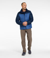 Men's two-tone navy puffer jacket with zip front, worn over dark shirt with khaki pants, full front view