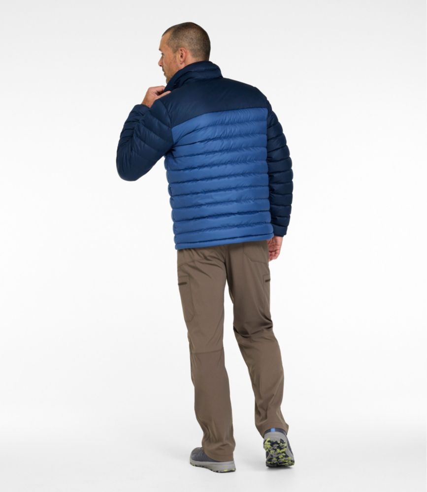Men's puffer jacket back view, two-tone blue quilted design, worn with khaki pants