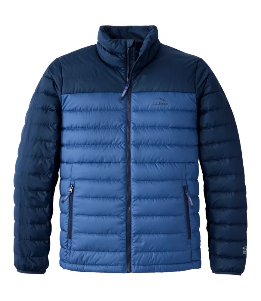 Men's quilted puffer jacket with two-tone navy colorblock design, stand collar, and zip pockets