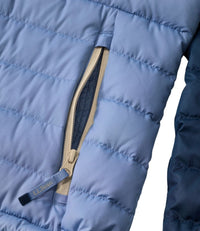 Close-up detail of quilted puffer jacket pocket with tan zipper pull tab