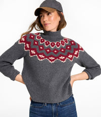 Women's mockneck sweater with Fair Isle yoke pattern in charcoal, paired with jeans and cap