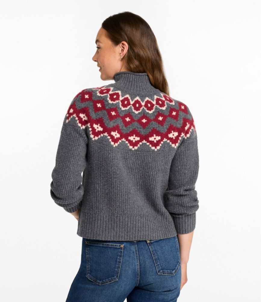 Women's fair isle mockneck sweater back view, charcoal gray with red geometric yoke pattern