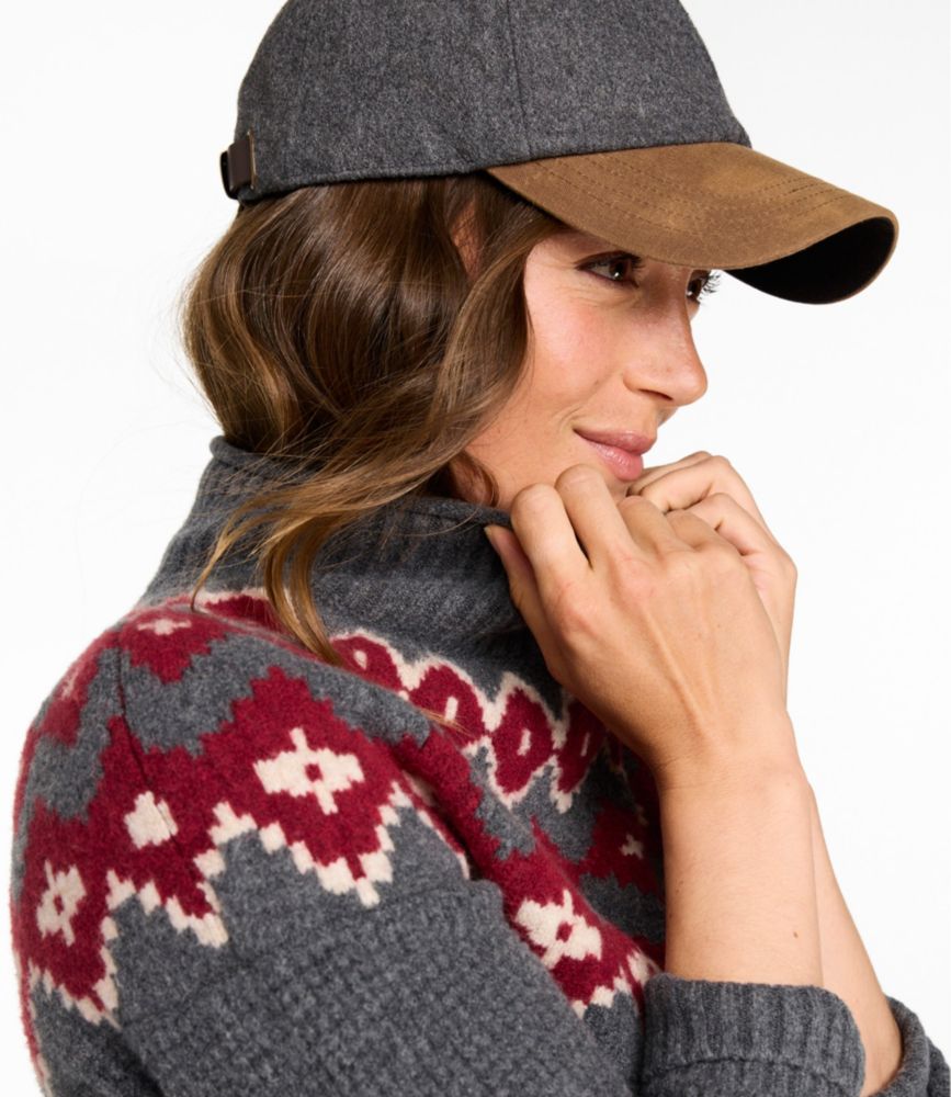 Women's fair isle mockneck sweater in charcoal with red geometric pattern, side detail view