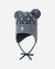 Knitted winter hat with geometric pattern, ear flaps, tie strings, and two pom-poms